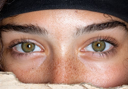 Close up of a persons eyes and face, showcasing skin texture and detail photo