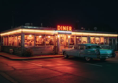 Experience the charm of a vintage diner at night, complete with a classic car. photo