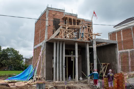 Villa under construction with worker at cloudy weather photo