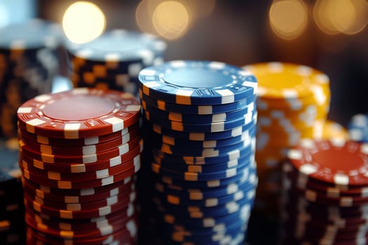 Stacks of poker chips forming colorful towers on blurred background photo