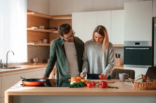 Preparing food ,together. Young. couple is on the kitchen photo