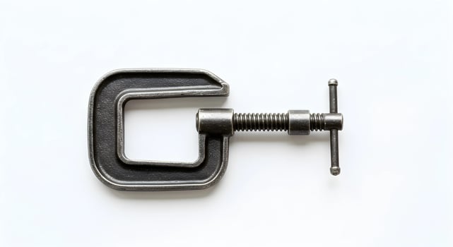 Close Up of a Metallic C-clamp Tool on White Background photo
