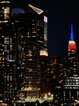 Empire State Building and NYC Skyscrapers Lit Up at Night with City Lights photo