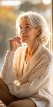 Woman reflecting in cozy setting during perimenopause photo