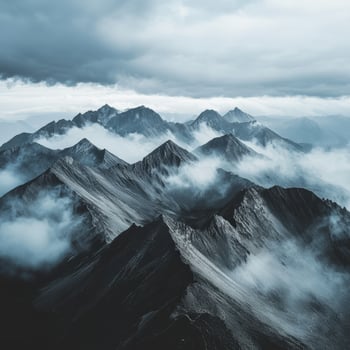 A view of mountains covered in clouds photo