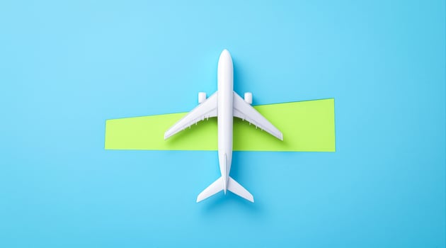 white airplane model on green surface blue background photo