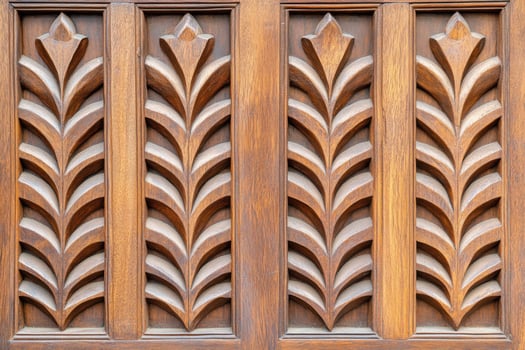 Close-up view of intricately carved wooden doors showcasing heritage craftsmanship and traditional artistry in a Kerala home photo