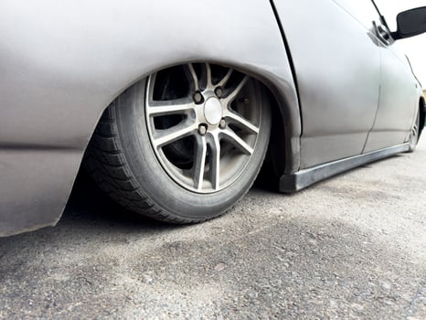 The most lowered car in the world. This car has lowest ground clearance on the planet. Tuned car with stance style suspension for cool look. Custom car with the bottom lowered to the asphalt photo