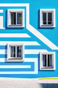 Facade in with geometric patterns and shadows making a bold urban statement photo