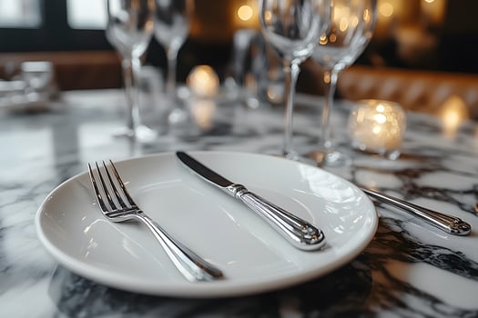 Elegant Dinner Setting with Cutlery and Glassware on Marble Table for Special Occasion photo