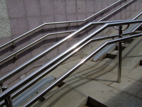 Handrail design on urban stairs shows functionality and modern photo