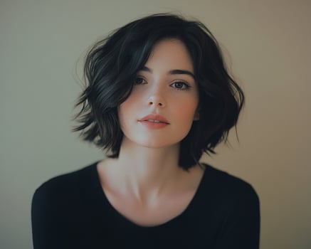 A woman with a short black hair and a black top photo