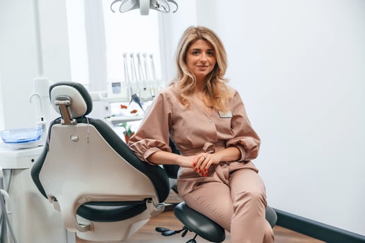 Beautiful woman, doctor is sitting.. In the stomatological cabinet photo