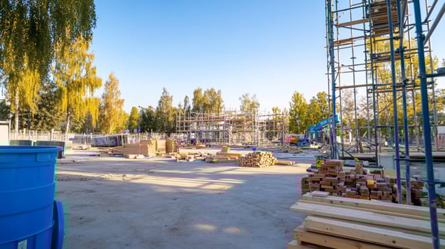 A construction site with a blue barrel photo