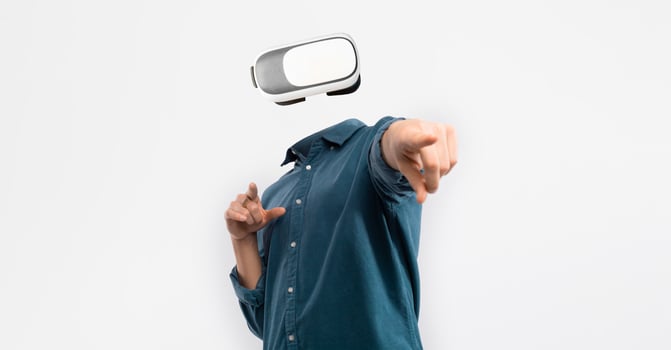 An individual engages with advanced virtual reality technology, wearing a headset that obscures their identity. The person points forward, emphasizing interaction and immersion in digital experiences. photo