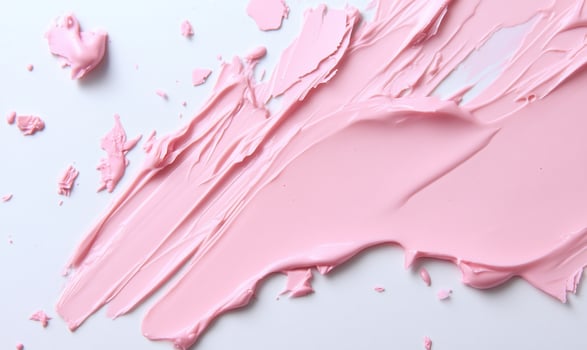 A pink paint splattered on a white surface photo