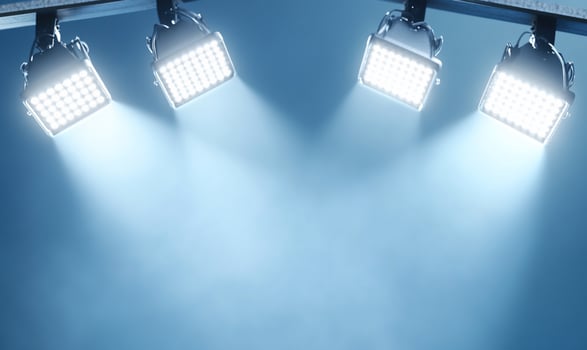 Three spotlights on a blue background photo