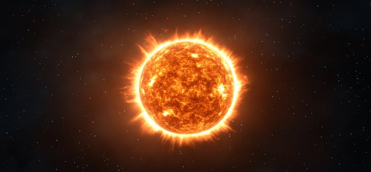 A bright, fiery sun surrounded by stars in a cosmic background. photo