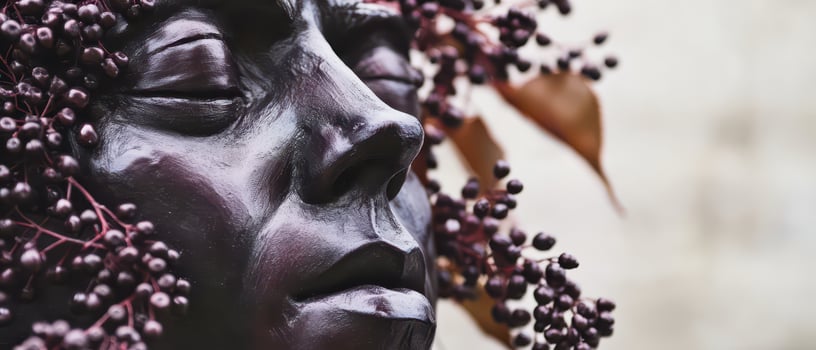 A statue of a woman with berries on her head photo