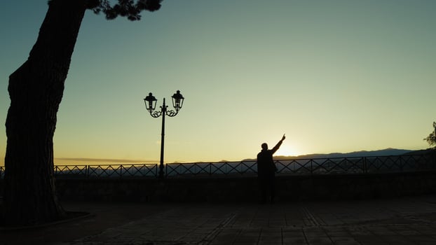 Silhouette Of A Man Indicates The Places Visible Overlooking The Sunset Outdoor photo