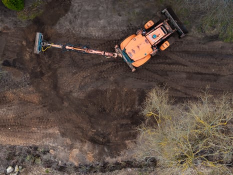 Aerial View of Orange Construction Vehicle on Dirt Covered Area photo