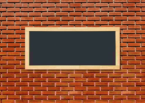 Blank blackboard isolated on red brick wall background. photo
