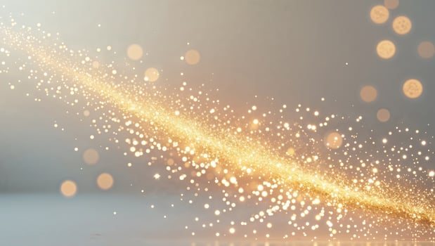 Golden sparkles on a white background photo