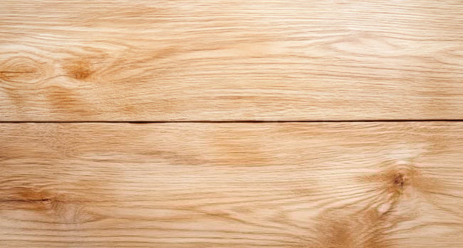 A close-up view of a smooth, light-colored wooden surface. photo