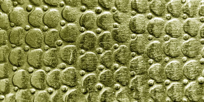 A close up of a gold snake skin texture photo