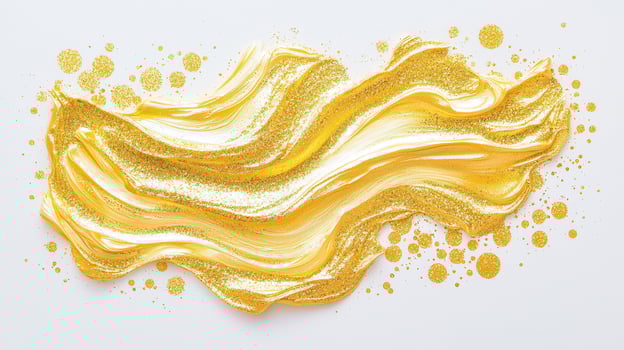 Gold paint brush strokes sweeping across white surface, revealing metallic artistic texture photo