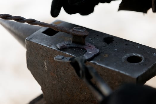 Stone in an anvil for horseshoes photo