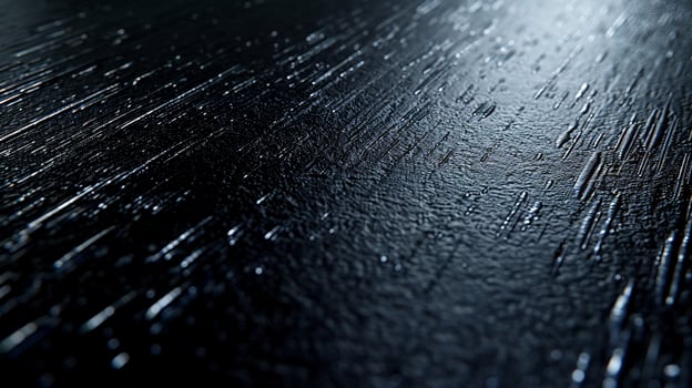 Dark, textured surface with linear patterns photo
