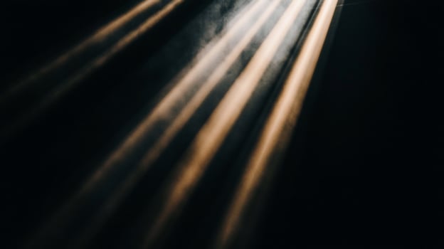 Light beams illuminating a dark space photo