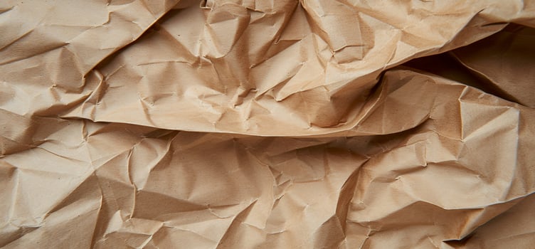A brown crumpled paper is shown in this photo