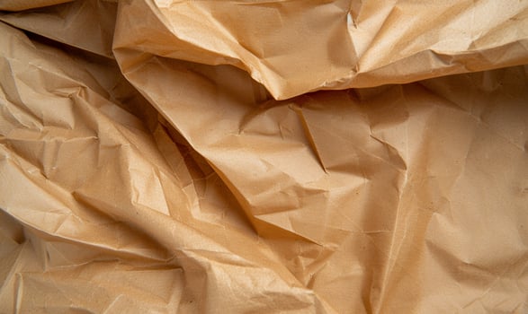 A brown crumpled paper is shown photo