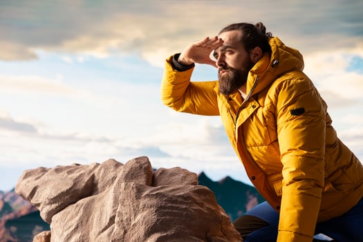 Trekker embracing challenge of mountain hiking with fresh air and epic view serving as reminder of personal strength and thrill of conquering fears. Seeking adventure. photo