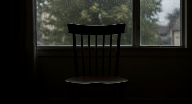 Rainy Day Solitude. A chair by the window, watching the rain fall photo