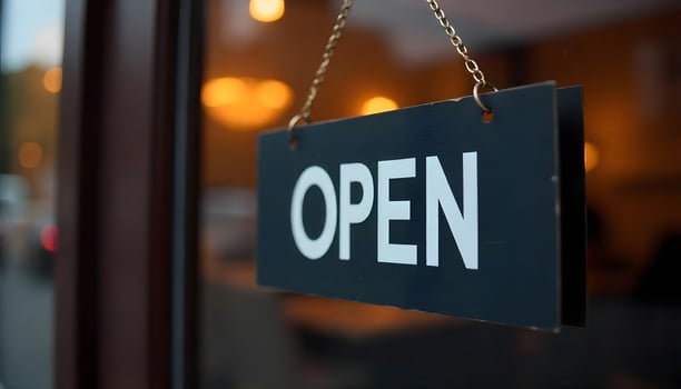 Open sign on a shop door, indicating the business is ready for customers. photo