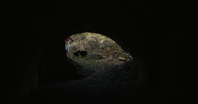 Three friends run into the basement of a destroyed building. The view from the inside photo