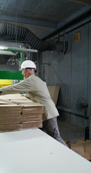 A man works in a paper mill. photo
