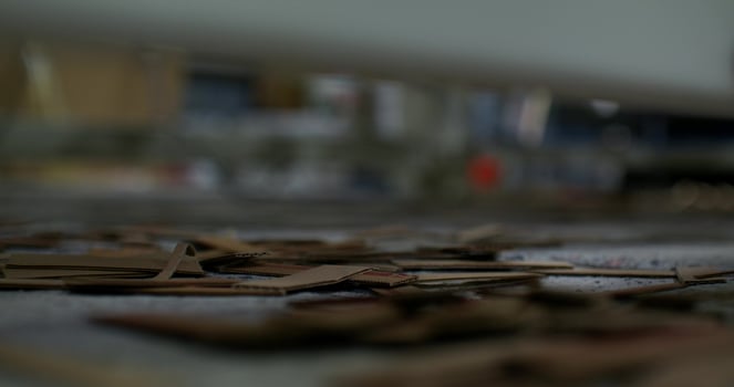 A close up of a machine that is making wooden pieces photo