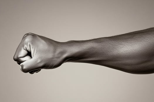 A man's arm is pointing up in the air photo