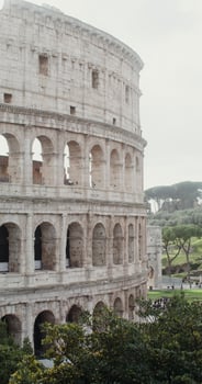 Close-up of the side of the Coliseum on a sunny warm day. Italy tourist attraction, Rome. in 4k, red komodo, vertical photo
