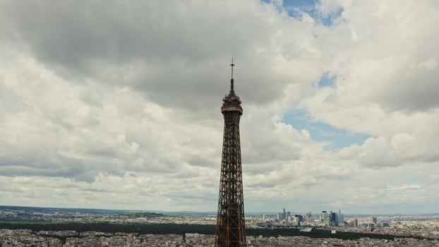 The top of the Eiffel Tower, aerial view from a drone on a cloudy day. The spire of the Eiffel Tower close-up. France Paris photo