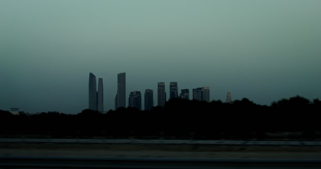 Panoramic view of metropolis with modern skyscrapers. from a moving car window, general view of the city photo