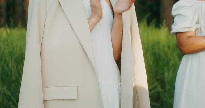 Elegant guests clap their hands when the bride passes by them. Outdoor wedding - passes photo
