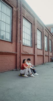 A couple sitting on the ground photo