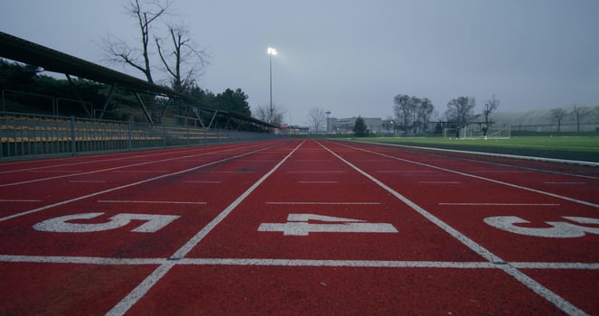 Running tracks in the stadium, close-up of the lined and numbered outdoor stadium flooring photo