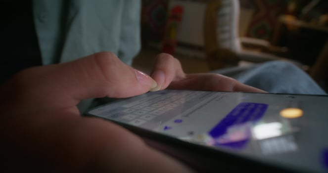 A person is using a smartphone with a text message on it photo