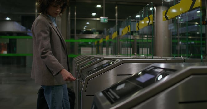 A woman is standing in front of a machine photo